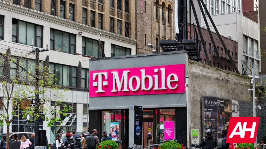 T-Mobile store logo illuminated on an exterior building wall